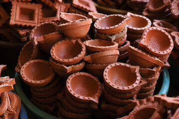 diya or clay lamp at market during Diwali festival in India.