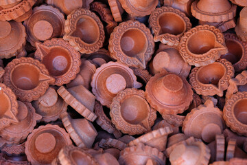 diya or clay lamp at market during Diwali festival in India.