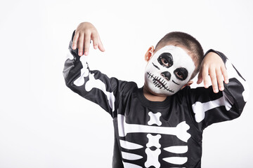 Halloween Kid. Portrait of Asian little kid boy wearing skeleton costume studio shot isolated white...
