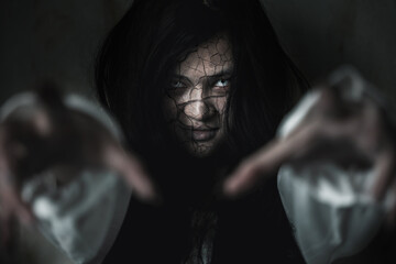 Scary ghost woman. Asian ghost or zombie horror creepy scary have hair covering face and eye reach...