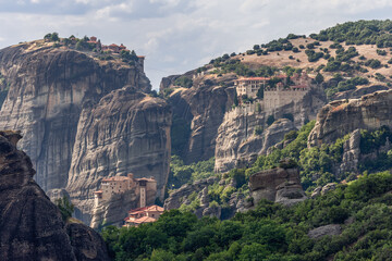 Fototapeta na wymiar Meteora is a complex of giant sandstone pillars climbing up into sky. On top of them, on tiny plateaus, the famous Meteora monasteries are nested and built with a complete lack of technology, Greece