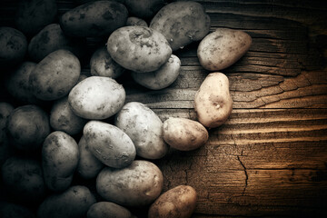 Potatoes over wooden vintage backdrop