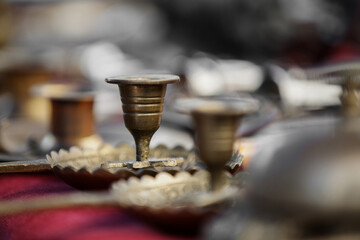 Metal cups in a thrift store.

