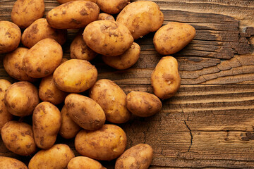 Potatoes over wooden vintage backdrop