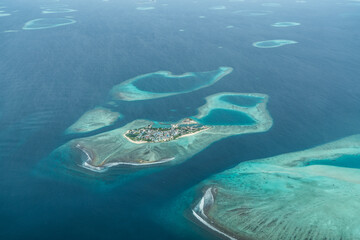 Aerial view of Gulhi Island, Maldives with beaches and Gulhi Harbour, Maldive Atoll - bird eyes view