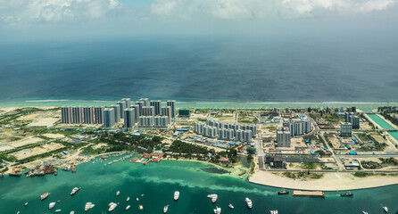 Hulhumalé, Maldives, October 2022, aerial view of the new developed and artificial Island Hulhumalé on North Malé Atoll with it's new buildings, yacht club and beaches - obrazy, fototapety, plakaty