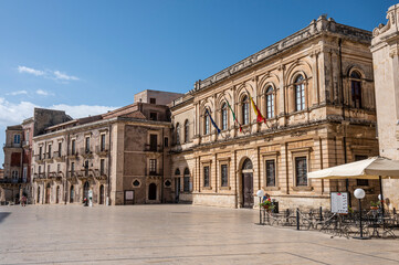 Fototapeta na wymiar Historic buildings with beautiful facades in Piazza Duomo in Ortigia