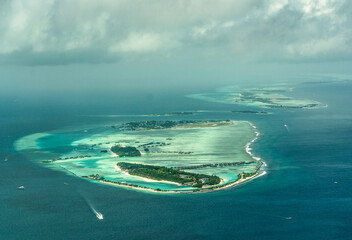 Aerial view of the Maldives islands and atolls. Maldives tourism and travel background. Beautiful...