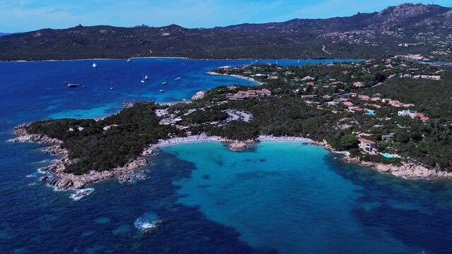Spiaggia del Pirata in Capriccioli, Sardinia, Italy. Aerial view of stunning coastline and emerald blue water.