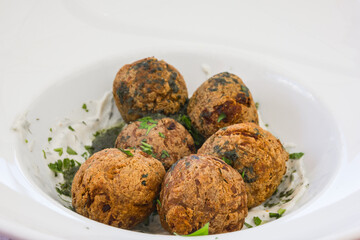 Fried falafel balls with sauce