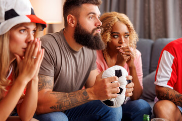 Friends watching football on TV