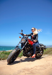 Fototapeta na wymiar attractive woman on motorcycle outdoors