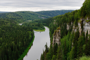 Picturesque rock Chertov Finger and Usva river. View from above. Massif Usvinskiye Pillars. Perm...