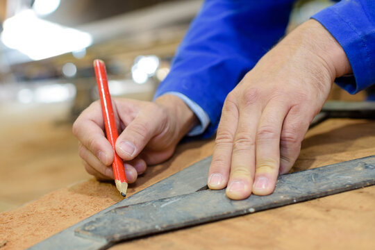 A Hand Doing An Accurate Measurement