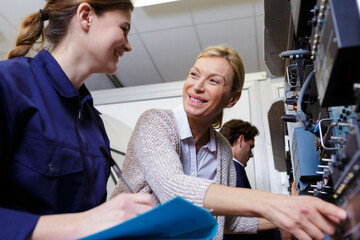 female technician and her apprentice