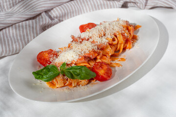 Homemade Bucatini, Amatriciana Pasta with bacon, cherry tomatoes and parmesan