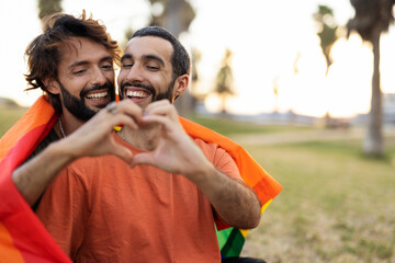 Happy couple with a pride flag. LGBT community...