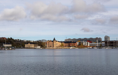 Fototapeta premium Sweden. Gustavsberg. City embankment under cloudy sky