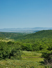 Fototapeta na wymiar Scenic view of green meadows big mountain Dagestan