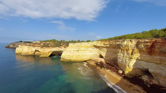 View on the steep cliffs of the Algarve coast in Portugal