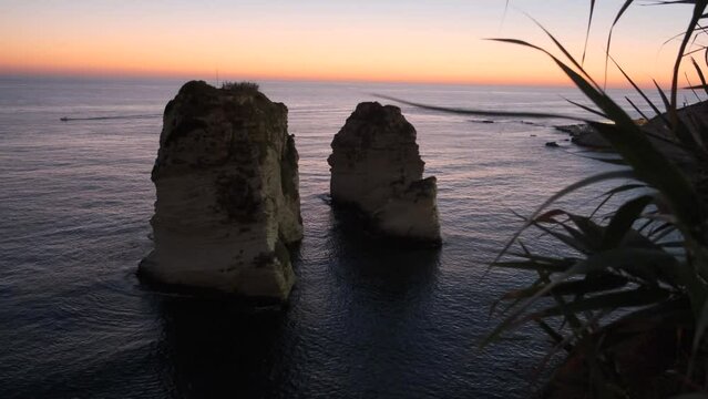 Pan shot of Al-Raouche rocks at sunset on Beirut, Lebaon