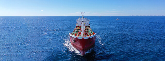 Aerial drone ultra wide panoramic photo with copy space of huge crude oil tanker cruising in open...