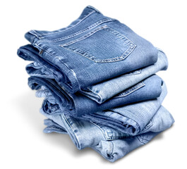 Pile of blue jeans over white background