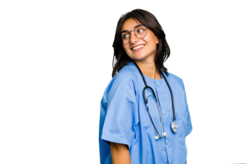 Young nurse Indian woman isolated looks aside smiling, cheerful and pleasant.