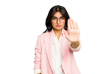 Young Indian business woman wearing a pink suit isolated standing with outstretched hand showing...