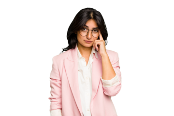 Young Indian business woman wearing a pink suit isolated pointing temple with finger, thinking, focused on a task.