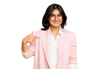 Young Indian business woman wearing a pink suit isolated person pointing by hand to a shirt copy space, proud and confident