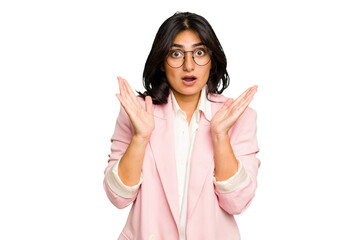 Young Indian business woman wearing a pink suit isolated surprised and shocked.