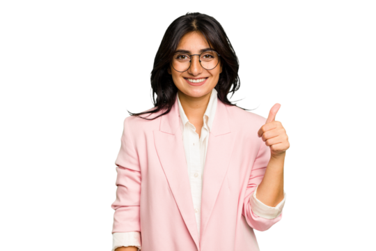 Young Indian business woman wearing a pink suit isolated smiling and raising thumb up