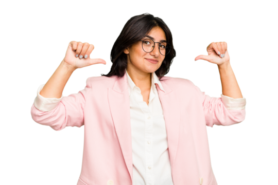 Young Indian business woman wearing a pink suit isolated feels proud and self confident, example to follow.