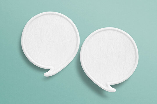 double blank white speech bubble with border paper cut on grunge green paper background. Conceptual image about communication and social media, customer feedback