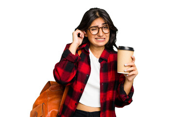Young student Indian woman holding a take away coffee isolated covering ears with hands.
