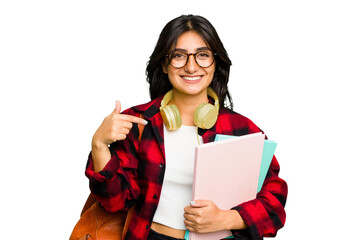 Young student Indian woman wearing headphones isolated person pointing by hand to a shirt copy space, proud and confident