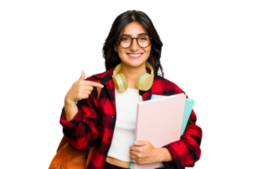 Young student Indian woman wearing headphones isolated person pointing by hand to a shirt copy space, proud and confident