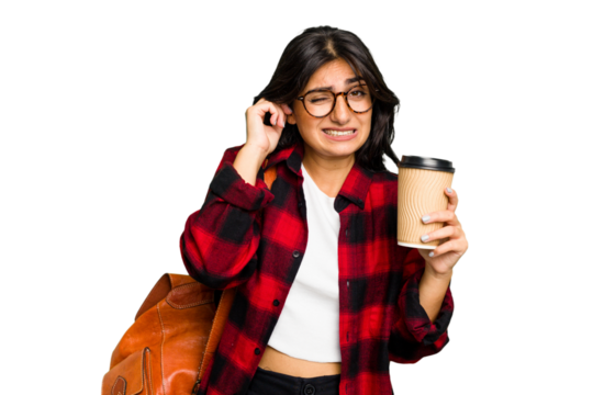 Young student Indian woman holding a take away coffee isolated covering ears with hands.