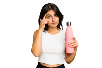 Young Indian woman holding a thermo isolated pointing temple with finger, thinking, focused on a task.