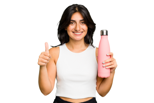 Young Indian woman holding a thermo isolated smiling and raising thumb up