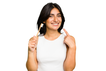 Young Indian woman holding a toothbrush isolated