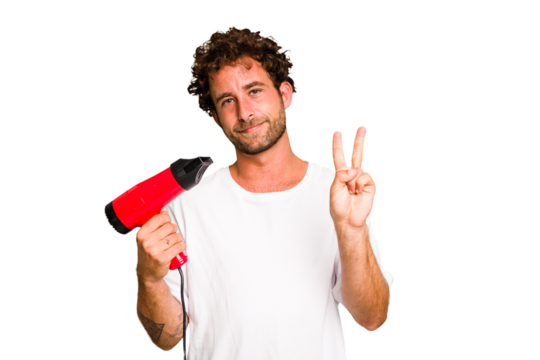 Young caucasian man holding an hairdryer isolated showing number two with fingers.
