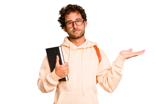 Young caucasian student man isolated showing a copy space on a palm and holding another hand on waist.