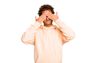 Young caucasian curly hair man isolated Young caucasian man with curly hair isolated afraid covering eyes with hands.