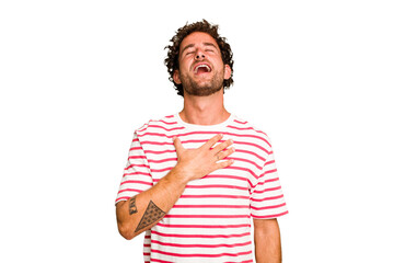 Young caucasian curly hair man isolated Young caucasian man with curly hair isolated laughs out loudly keeping hand on chest.