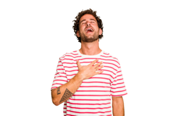 Young caucasian curly hair man isolated Young caucasian man with curly hair isolated laughs out loudly keeping hand on chest.
