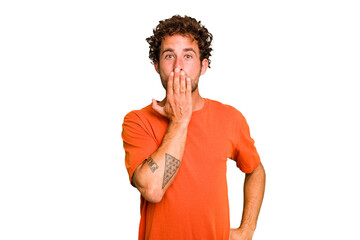 Young caucasian curly hair man isolated Young caucasian man with curly hair isolated shocked, covering mouth with hands, anxious to discover something new.