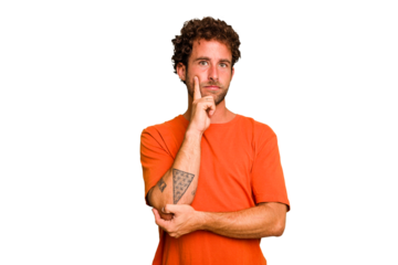 Young caucasian curly hair man isolated Young caucasian man with curly hair isolated looking sideways with doubtful and skeptical expression.