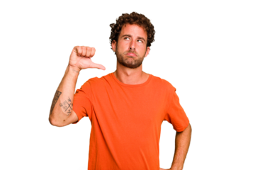 Young caucasian curly hair man isolated Young caucasian man with curly hair isolated showing a dislike gesture, thumbs down. Disagreement concept.
